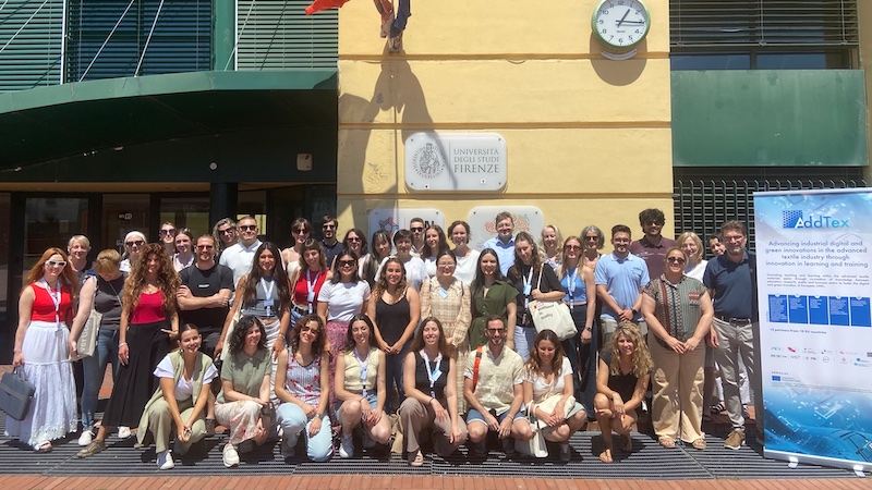 Joint photo of the ADDTEX partners and the summer school students in front of the entrance to the PIN in Prato. Photo: ADDTEX, Alessandro de Rosa