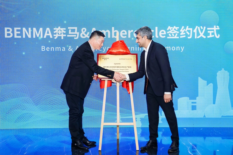 Benma and Ambercycle at Signing Ceremony (From left to right: Xu Guoliang – Chairman, Benma; Shay Sethi – CEO, Ambercycle). Ambercycle and Benma have partnered to scale the production of cycora® staple fibers by leveraging their combined expertise and Benma’s direct investment in Ambercycle’s technology scale-up © 2025 Ambercycle