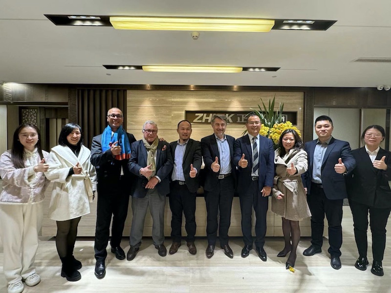 Emmanuel Ladent, CEO, CARBIOS (fifth from right) and Zhu GuoYang, President of Zhink Group (fourth from right) surrounded by their teams at Zhink Group’s Headquarters in Hangzhou © 2024 CARBIOS