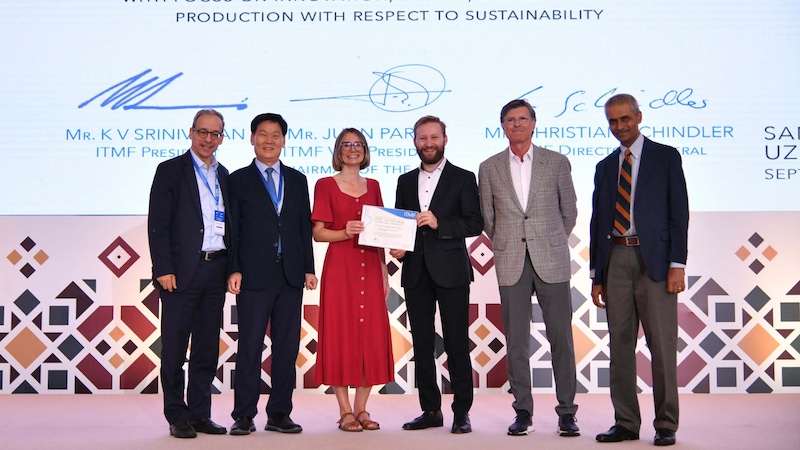 Presentation of the ITMF Award to Dr. Marc Vocht (DITF) and Anne Reboux (RBX Créations) at the ITMF Conference in Samarkand. Photo: ITMF