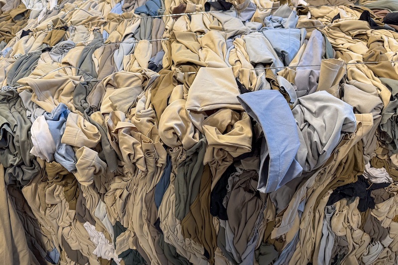 Apparel waste bales for shipping © 2024 Debrand