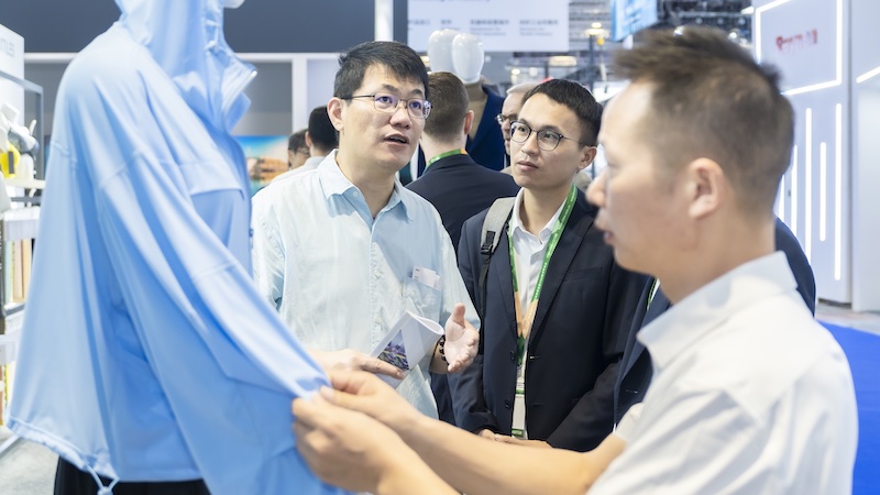 Demonstration of sun protection fabrics at KARL MAYER booth at ITMA Asia + CITME 2024 © 2024 KARL MAYER