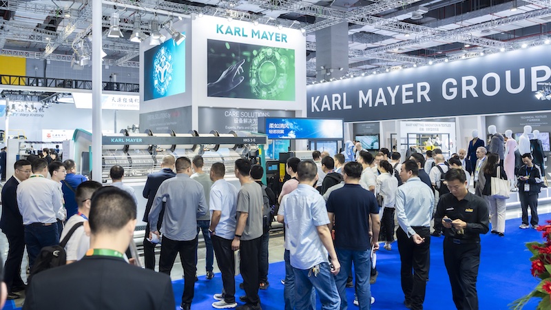 A lot of visitors  at the KARL MAYER STOLL booth © 2024 KARL MAYER