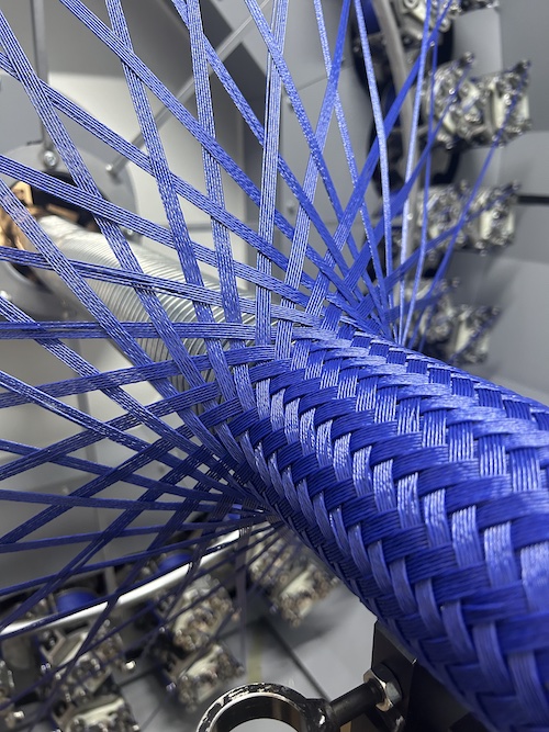 Braiding machine with blue yarn © 2025 Mayer & Cie. Braiding machine with blue yarn © 2025 Mayer & Cie.