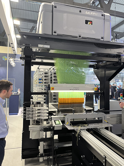 A 2,688-hook Stäubli SX jacquard and harness feeds the loom. © 2023 ASCC A 2,688-hook Stäubli SX jacquard and harness feeds the loom. © 2023 ASCC