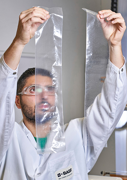 Burak Karadeniz, Lab technician at the Application Centre for BASF Plastic Additives in Kaisten, is comparing the optical properties of recycled film with and without a stabilizer package.  © 2022 BASF