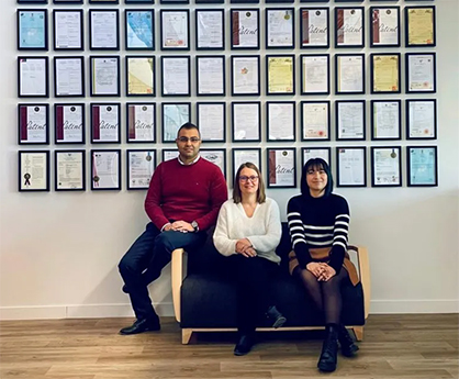 Fig 2. The Carbios Intellectual Property team in front of granted patents (l. to r. : Georges ZAKHIA, Lise LUCCHESI (Director) and Jade FESANCIEUX) © 2023 Carbios