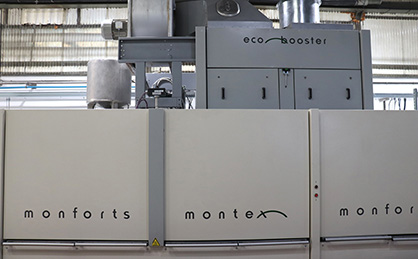 The stenter is one of the first in Europe to benefit from the integration of the self-cleaning Monforts Eco Booster heat recovery unit. (c) 2018 Monforts The stenter is one of the first in Europe to benefit from the integration of the self-cleaning Monforts Eco Booster heat recovery unit. (c) 2018 Monforts